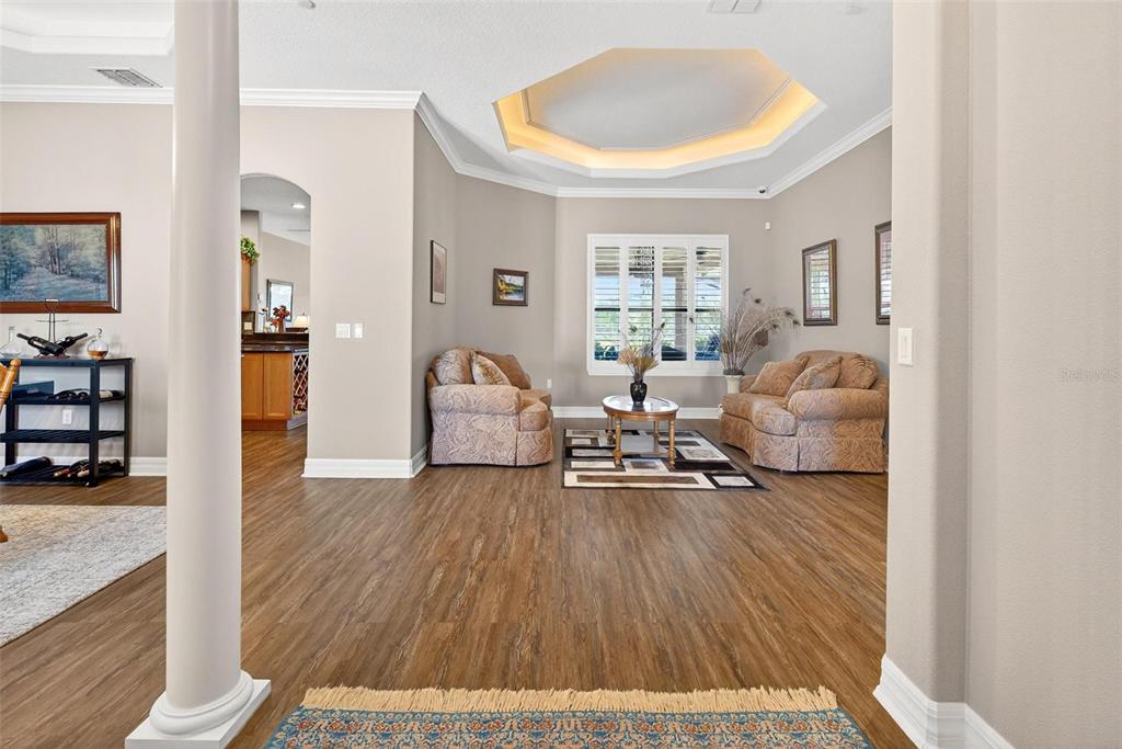 19850 Sugarloaf Mountain Road Clermont, FL 34715 - Photo 10 of 100 a living room with furniture and wooden floor