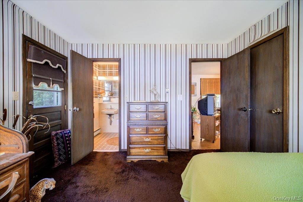 3 Stone Path Rock Hill, NY 12775 - Photo 15 of 33 a bedroom with a bed and wooden floor