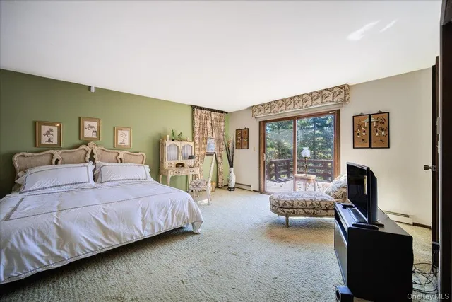 a bedroom with a large bed and furniture