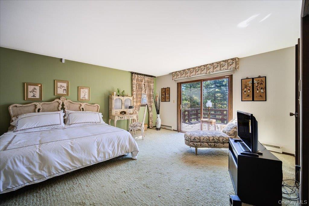 3 Stone Path Rock Hill, NY 12775 - Photo 17 of 33 a bedroom with a bed and a couch