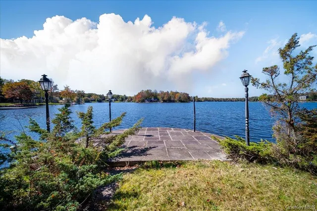 a kitchen with stainless steel appliances granite countertop a refrigerator a stove top oven a sink and dishwasher