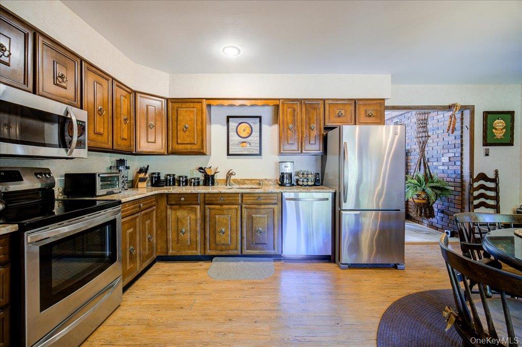 3 Stone Path Rock Hill, NY 12775 - Photo 4 of 33 a kitchen with stainless steel appliances granite countertop a refrigerator a stove top oven a sink and dishwasher