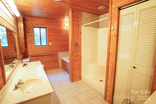 a bathroom with a tub and shower