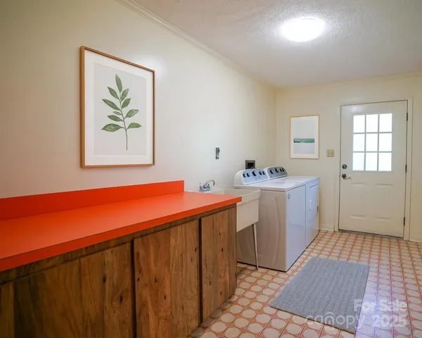 a view of a hallway with a sink and a window