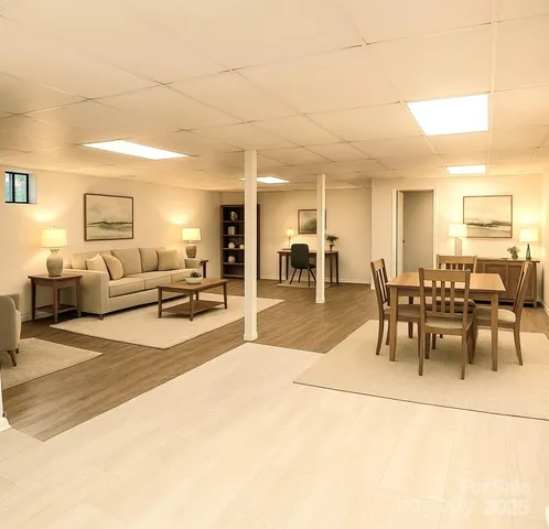 a lobby with furniture and a dining table