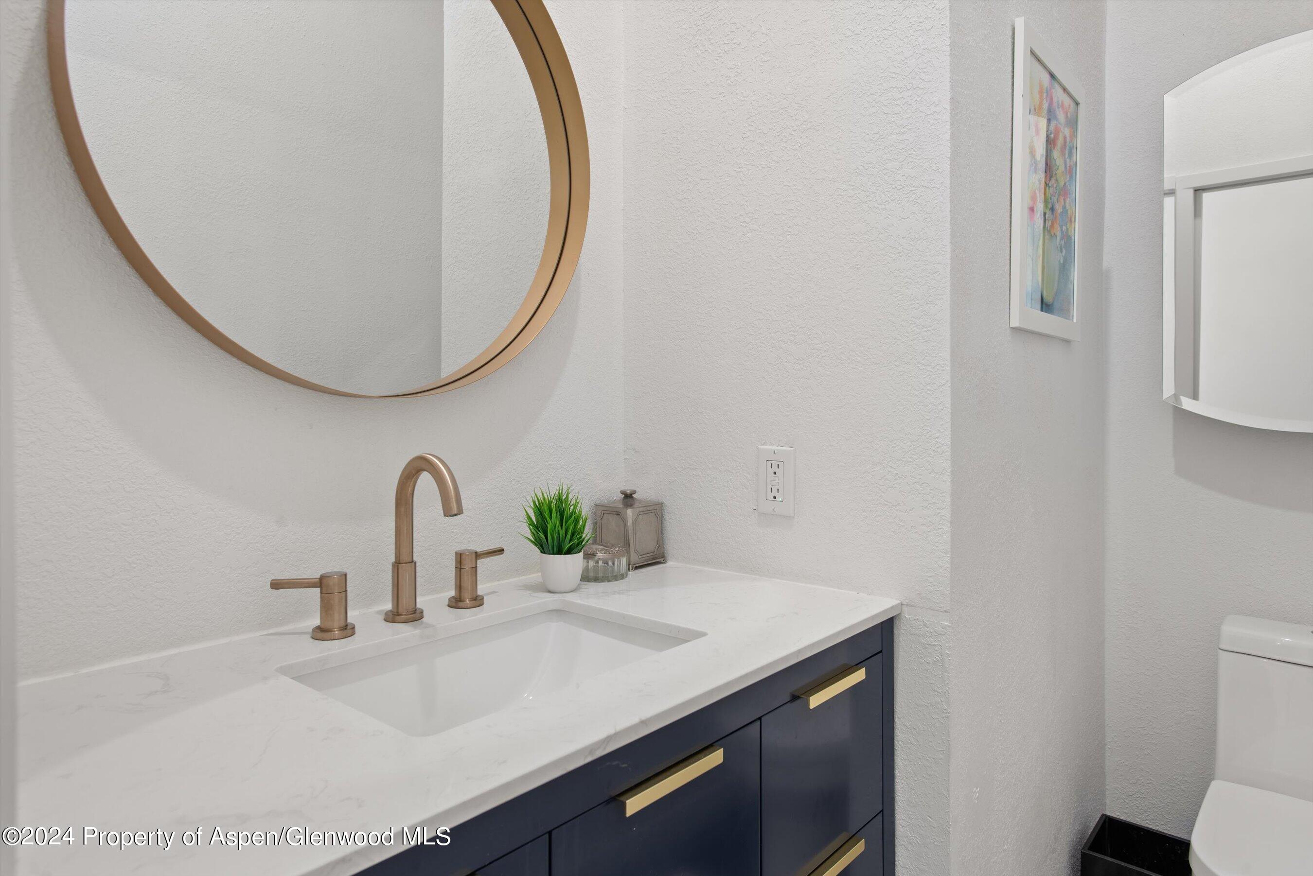 140 Maple Lane Aspen, CO 81611 - Photo 18 of 37 a bathroom with a sink and a mirror