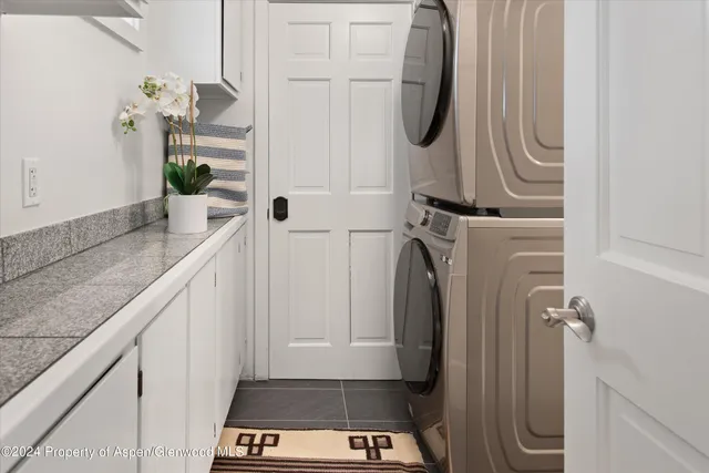 a bathroom with a sink vanity and shower