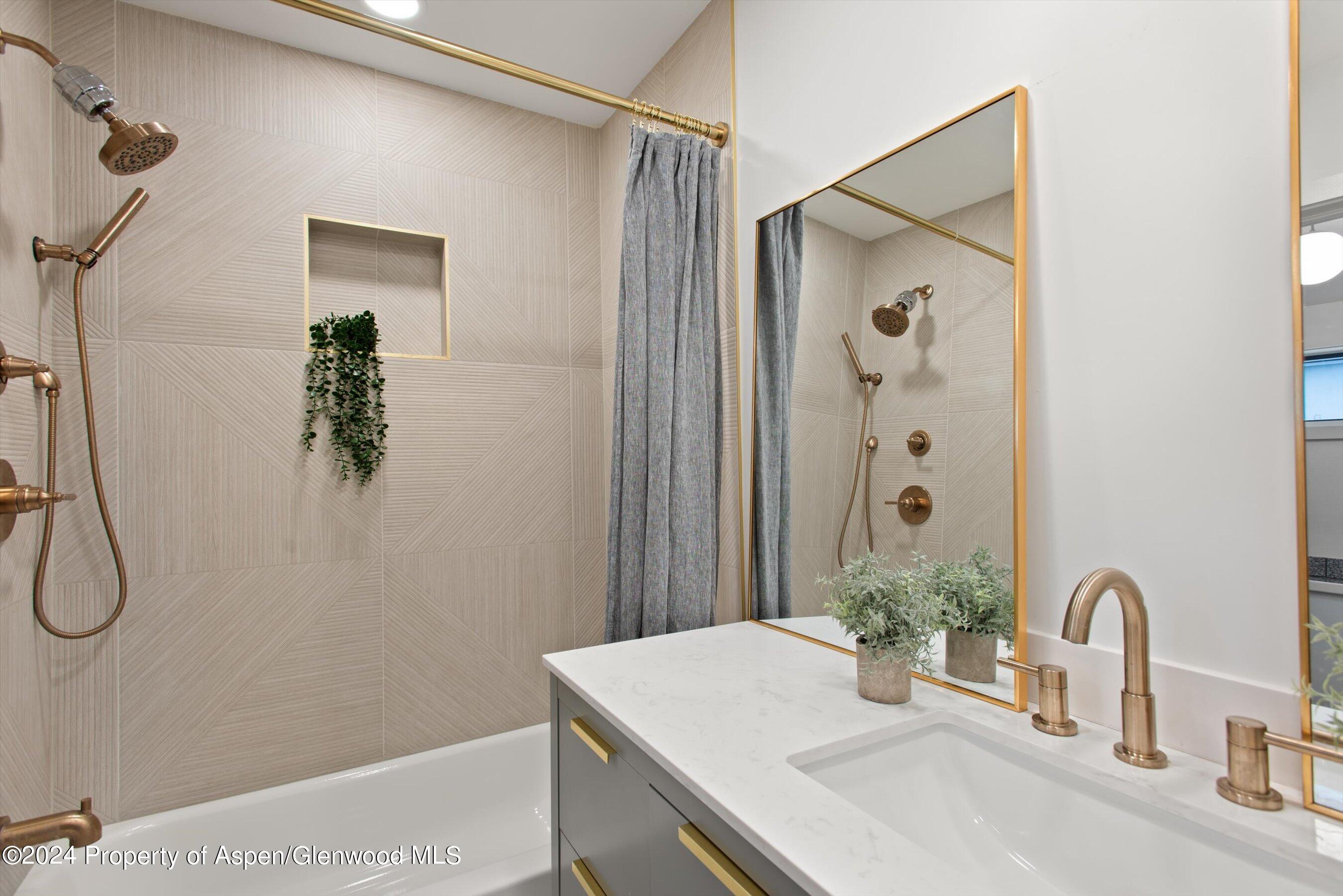 140 Maple Lane Aspen, CO 81611 - Photo 25 of 37 a bathroom with a sink vanity and shower