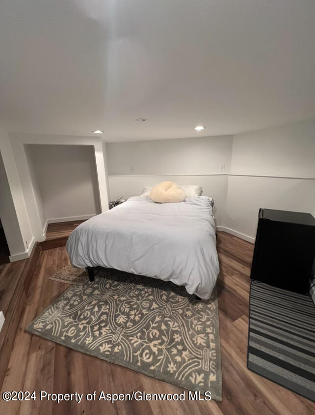 140 Maple Lane Aspen, CO 81611 - Photo 28 of 37 a bedroom with a bed and a night stand