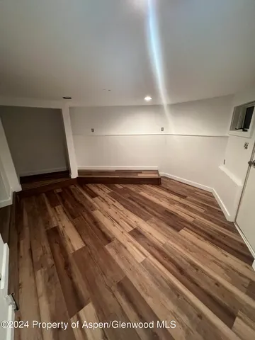 a kitchen with a white stove top oven and sink