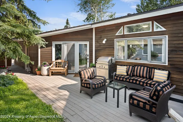 a front view of house with outdoor seating