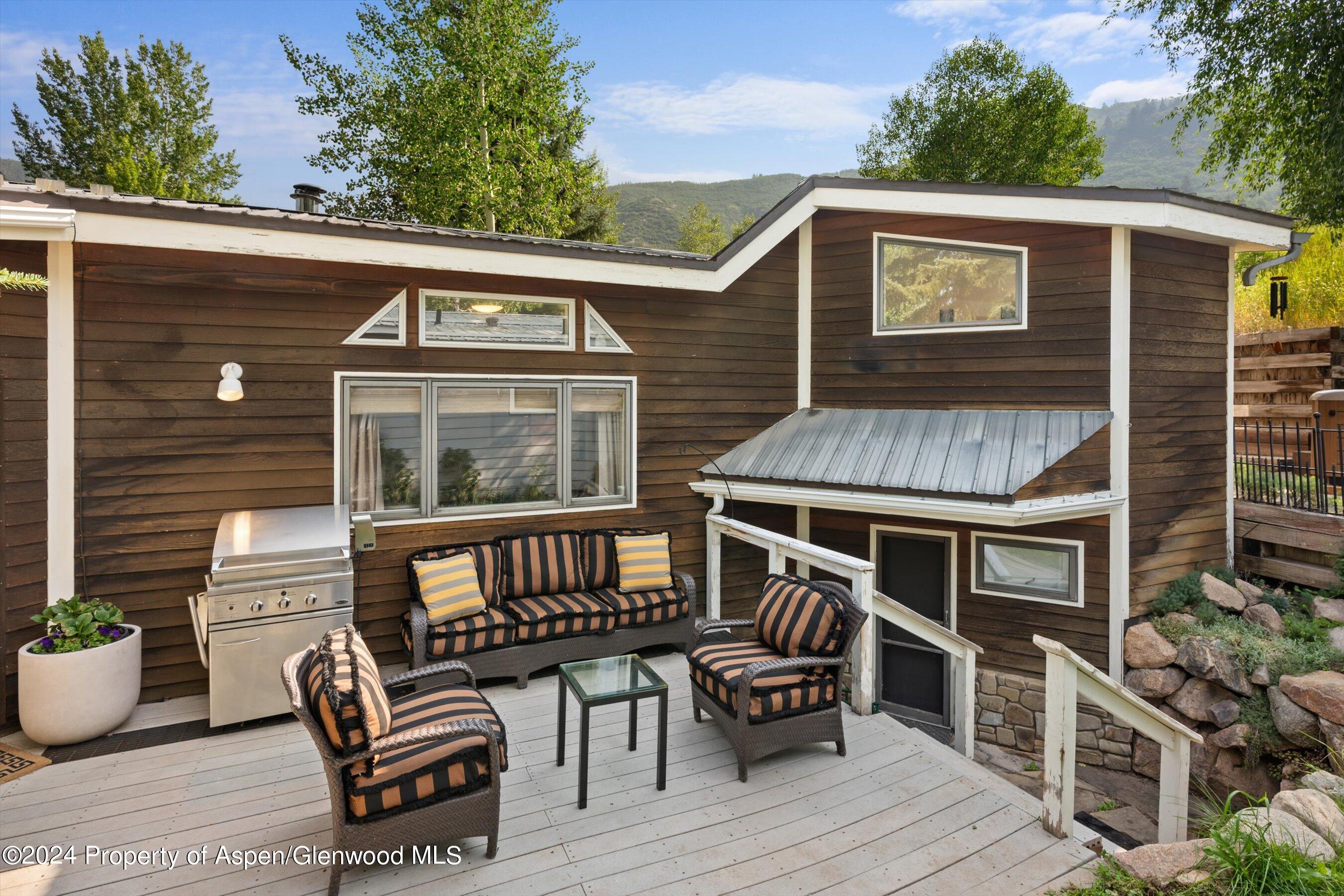 140 Maple Lane Aspen, CO 81611 - Photo 35 of 37 a view of outdoor space with a deck and furniture