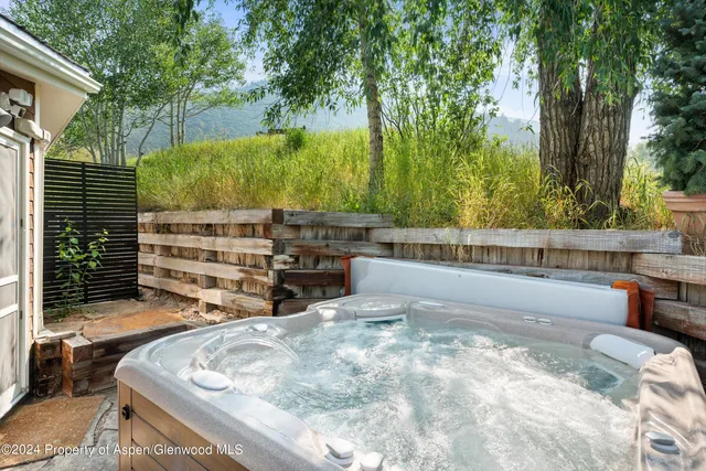 a view of swimming pool with a back yard