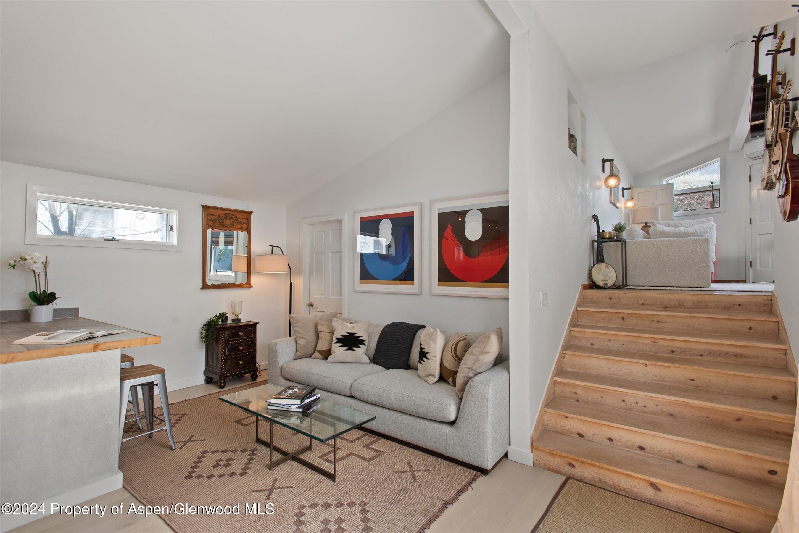 140 Maple Lane Aspen, CO 81611 - Photo 8 of 37 a living room with furniture and a stairs