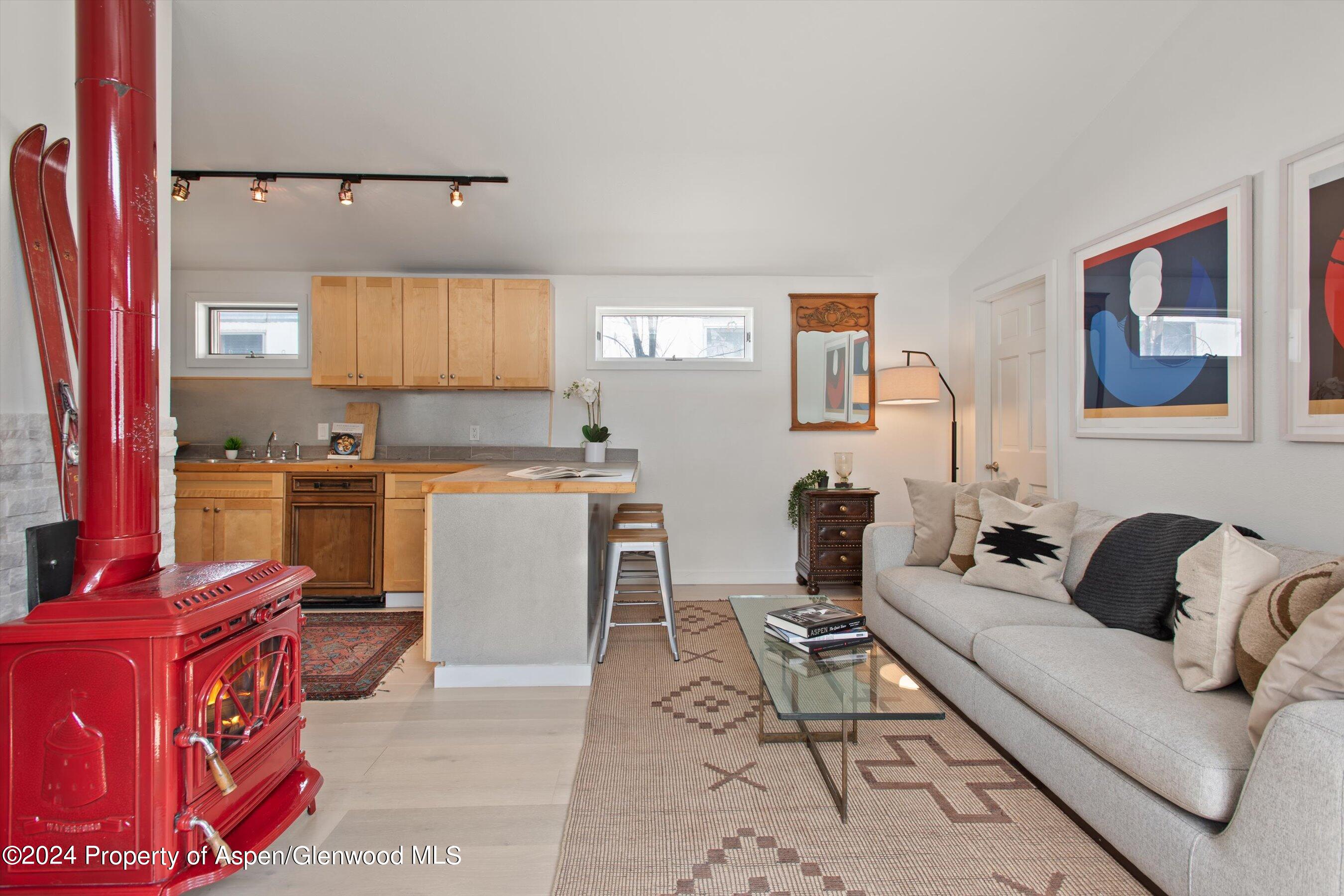 140 Maple Lane Aspen, CO 81611 - Photo 9 of 37 a living room with furniture and a window