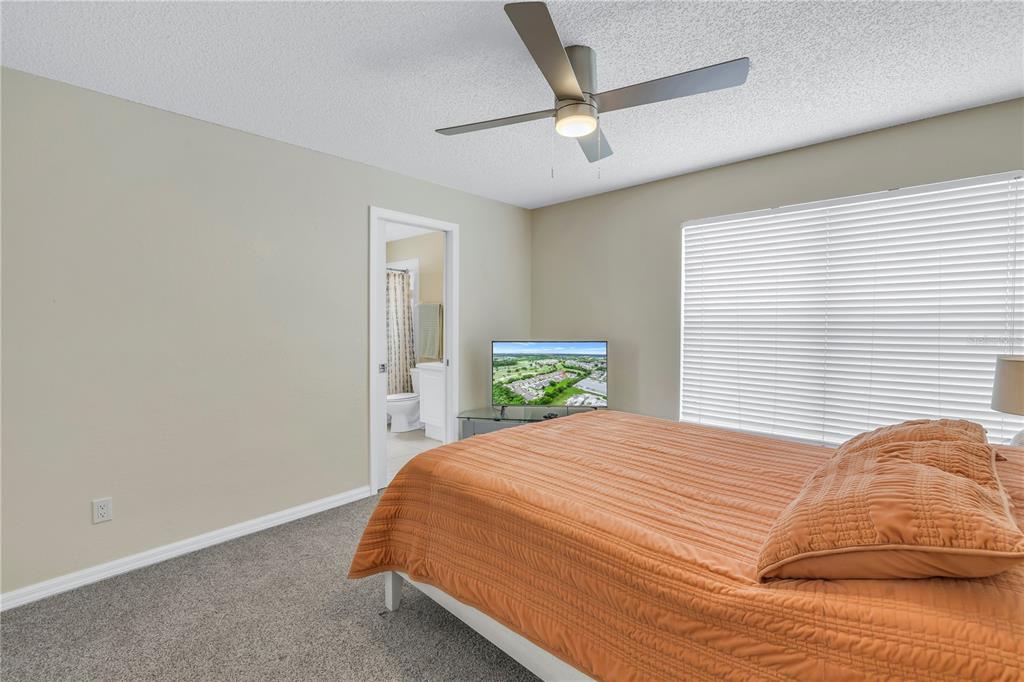 1050 Starkey Road, Unit 2201 Largo, FL 33771 - Photo 30 of 66 a bedroom with a bed garage and window