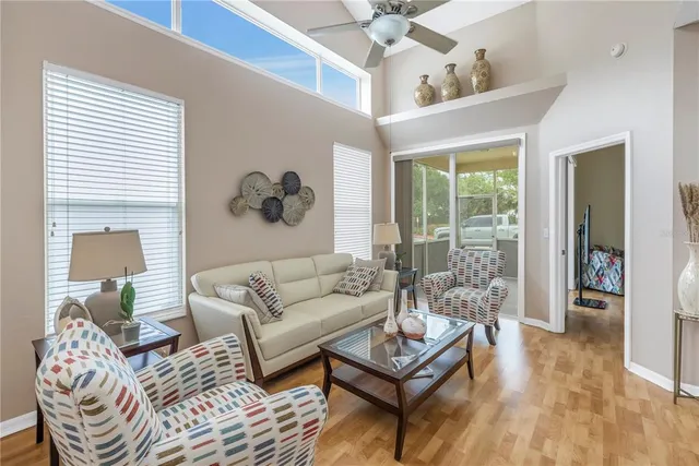 a living room with furniture and a large window