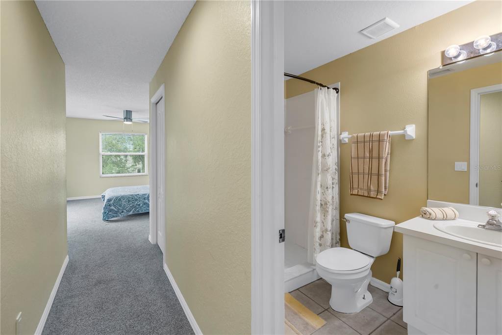 1050 Starkey Road, Unit 2201 Largo, FL 33771 - Photo 31 of 66 a bathroom with a sink a toilet and shower