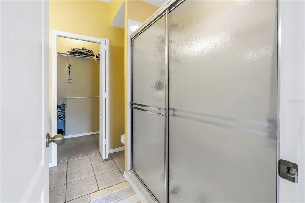 1050 Starkey Road, Unit 2201 Largo, FL 33771 - Photo 42 of 66 a bathroom with a glass shower door