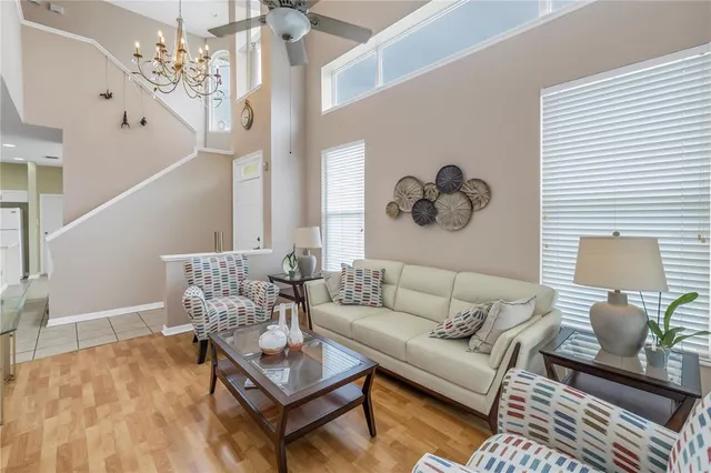 a living room with furniture and a painting