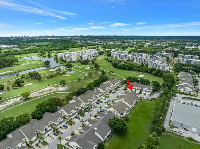 a view of a dining room with furniture wooden floor and a chandelier