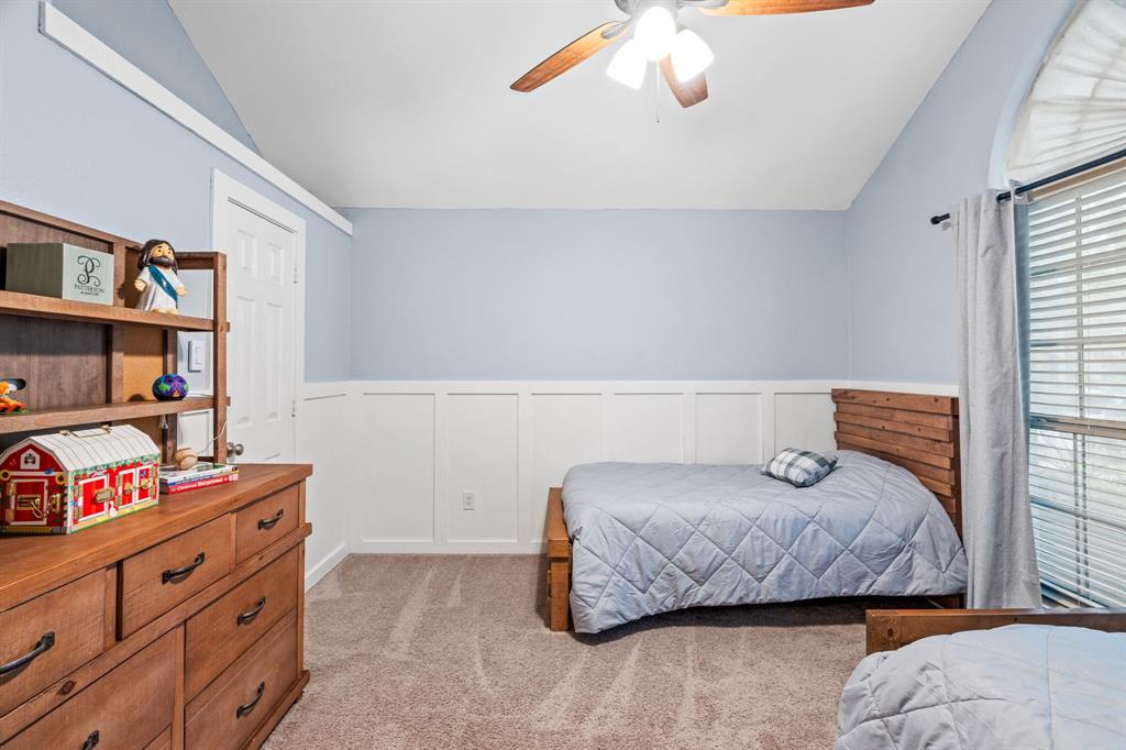 2302 Randi Road Rowlett, TX 75088 - Photo 23 of 33 a bedroom with a bed and a window