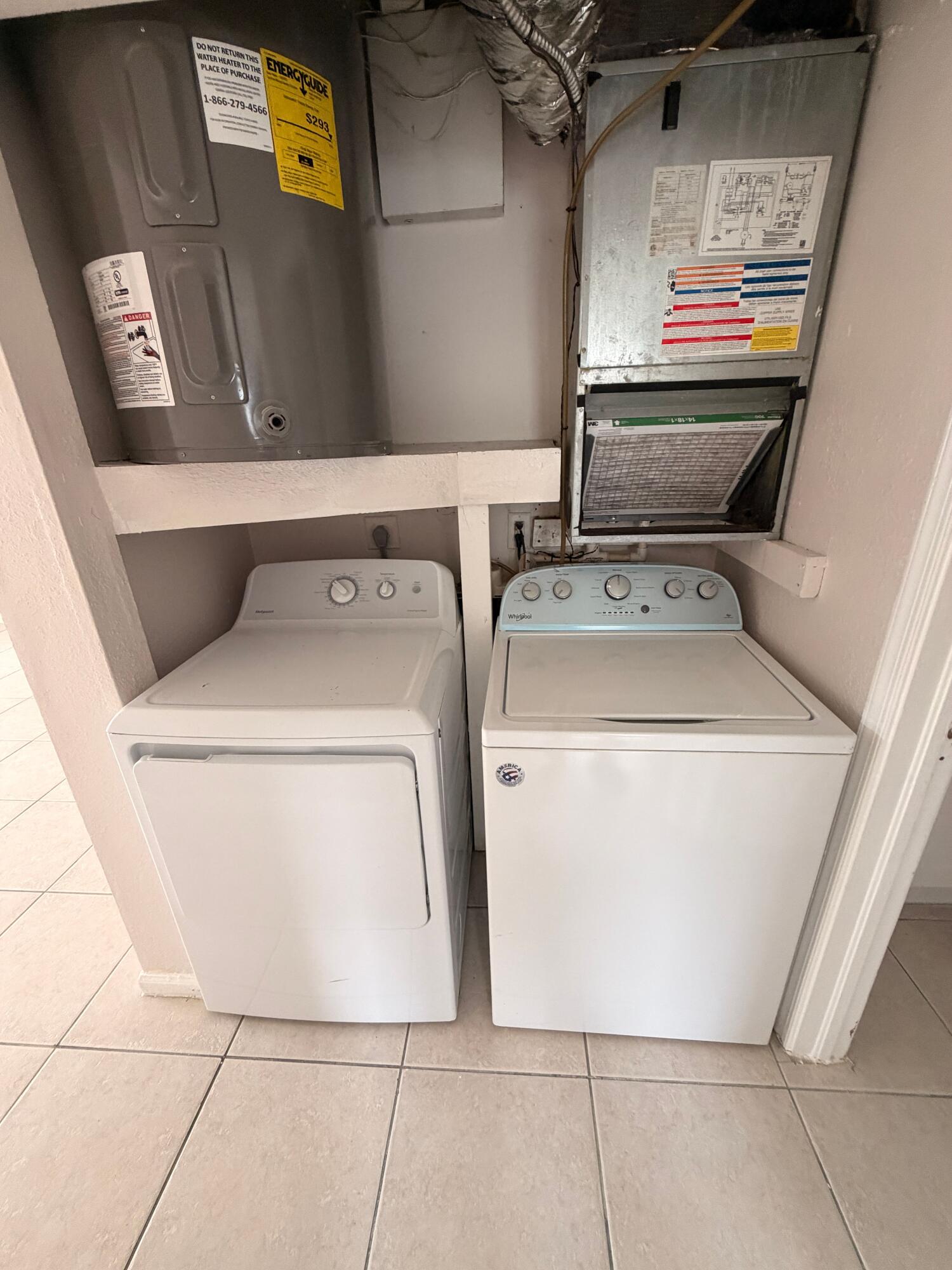 1618 West 26th Court, Unit A Riviera Beach, FL 33404 - Photo 6 of 15 a utility room with dryer and washer