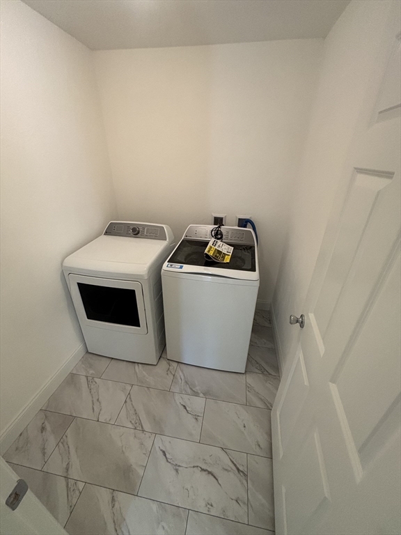 14 A Welch Avenue, Unit A Rutland, MA 01543 - Photo 17 of 25 a utility room with dryer and washer