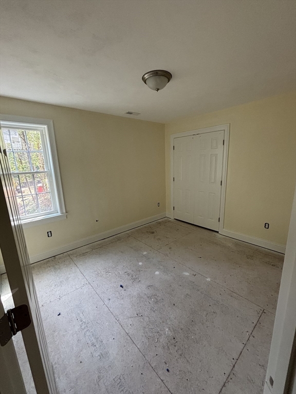 14 A Welch Avenue, Unit A Rutland, MA 01543 - Photo 20 of 25 an empty room with windows