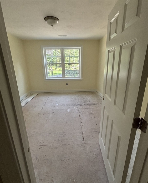 14 A Welch Avenue, Unit A Rutland, MA 01543 - Photo 21 of 25 an empty room with windows