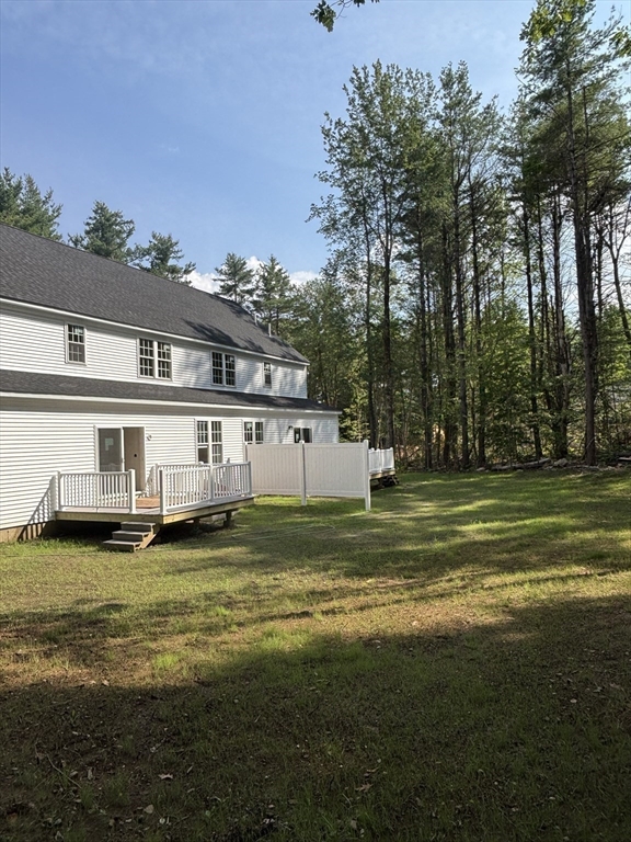 14 A Welch Avenue, Unit A Rutland, MA 01543 - Photo 24 of 25 a view of a big house with a big yard and large trees