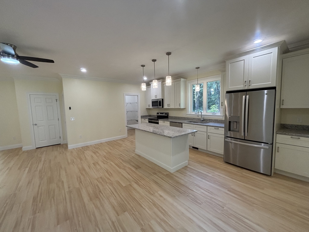 14 A Welch Avenue, Unit A Rutland, MA 01543 - Photo 5 of 25 a kitchen with stainless steel appliances a refrigerator sink and cabinets