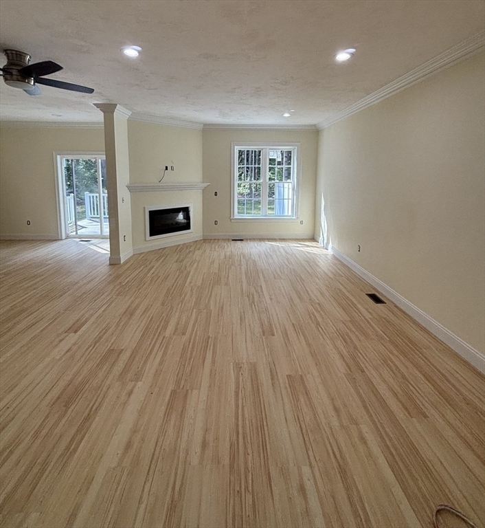 14 A Welch Avenue, Unit A Rutland, MA 01543 - Photo 7 of 25 an empty room with windows and fireplace