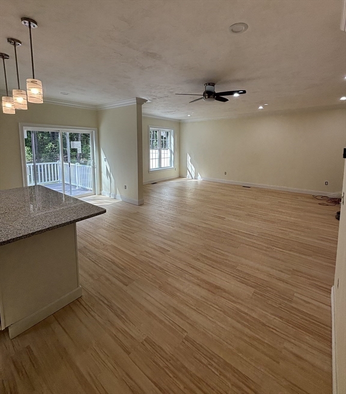 14 A Welch Avenue, Unit A Rutland, MA 01543 - Photo 8 of 25 an empty room with wooden floor and windows