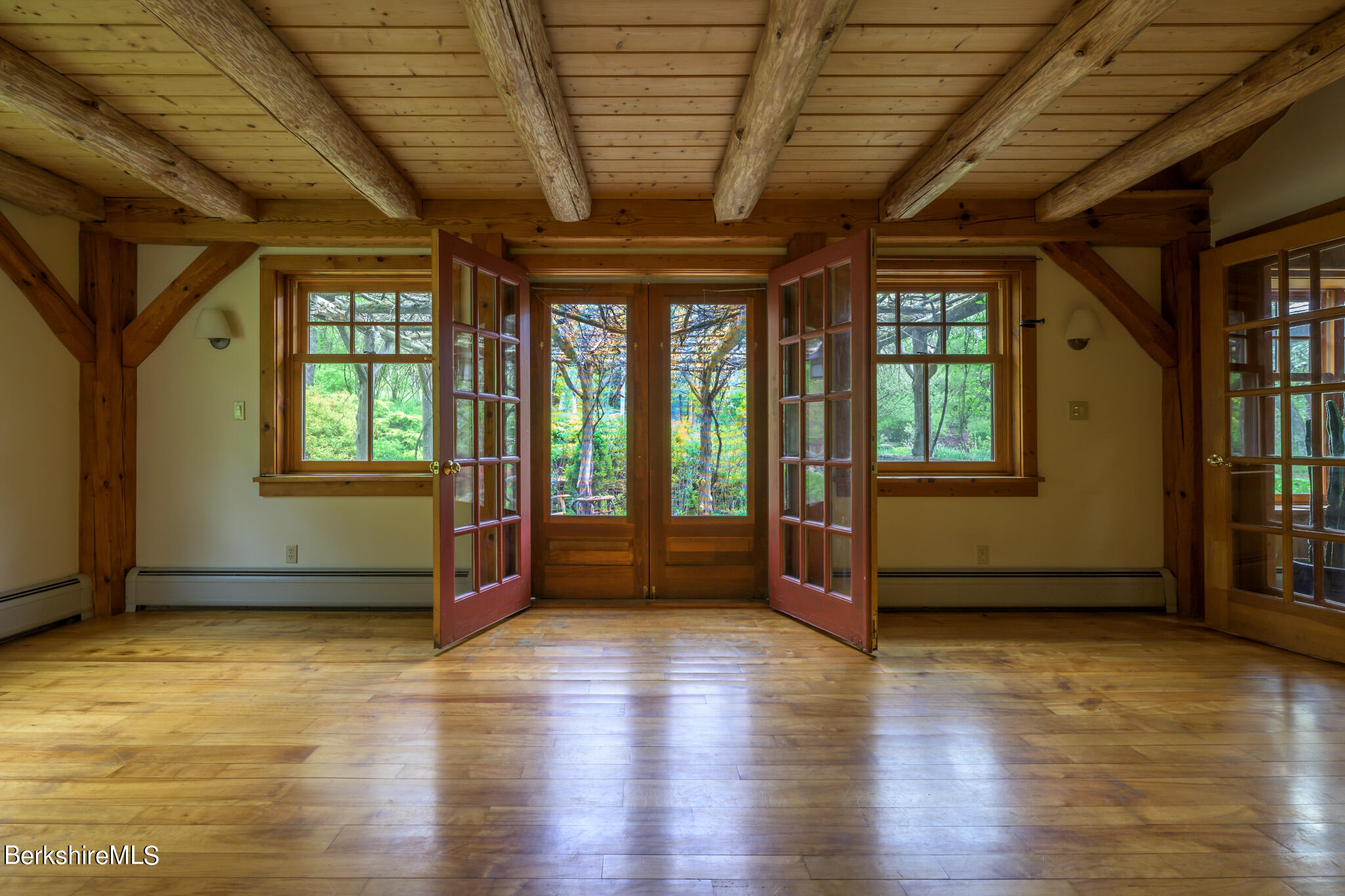 258 E Road Alford, MA 01266 - Photo 20 of 38 a view of an empty room with wooden floor and a window