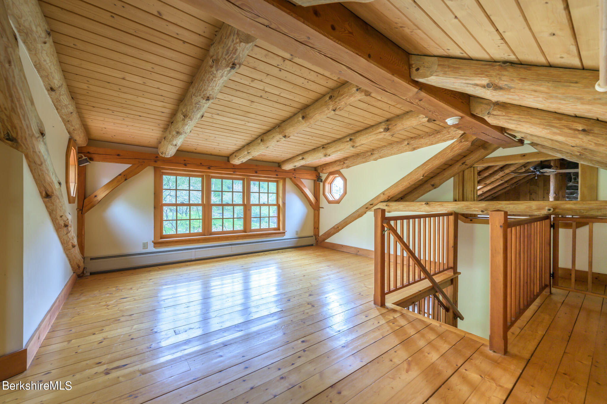 258 E Road Alford, MA 01266 - Photo 22 of 38 a view of an empty room with wooden floor and a window