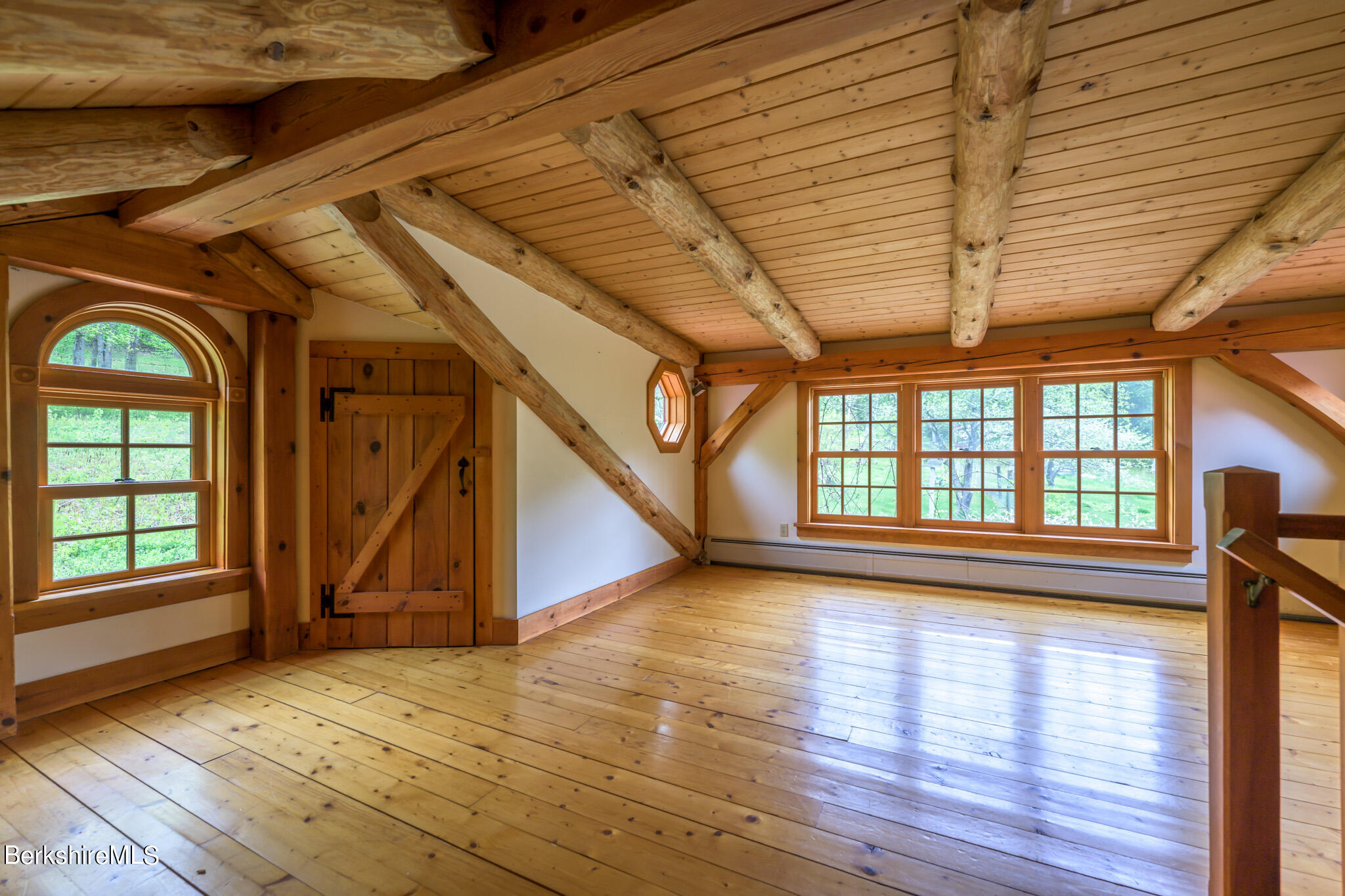258 E Road Alford, MA 01266 - Photo 23 of 38 a view of an empty room with wooden floor and a window