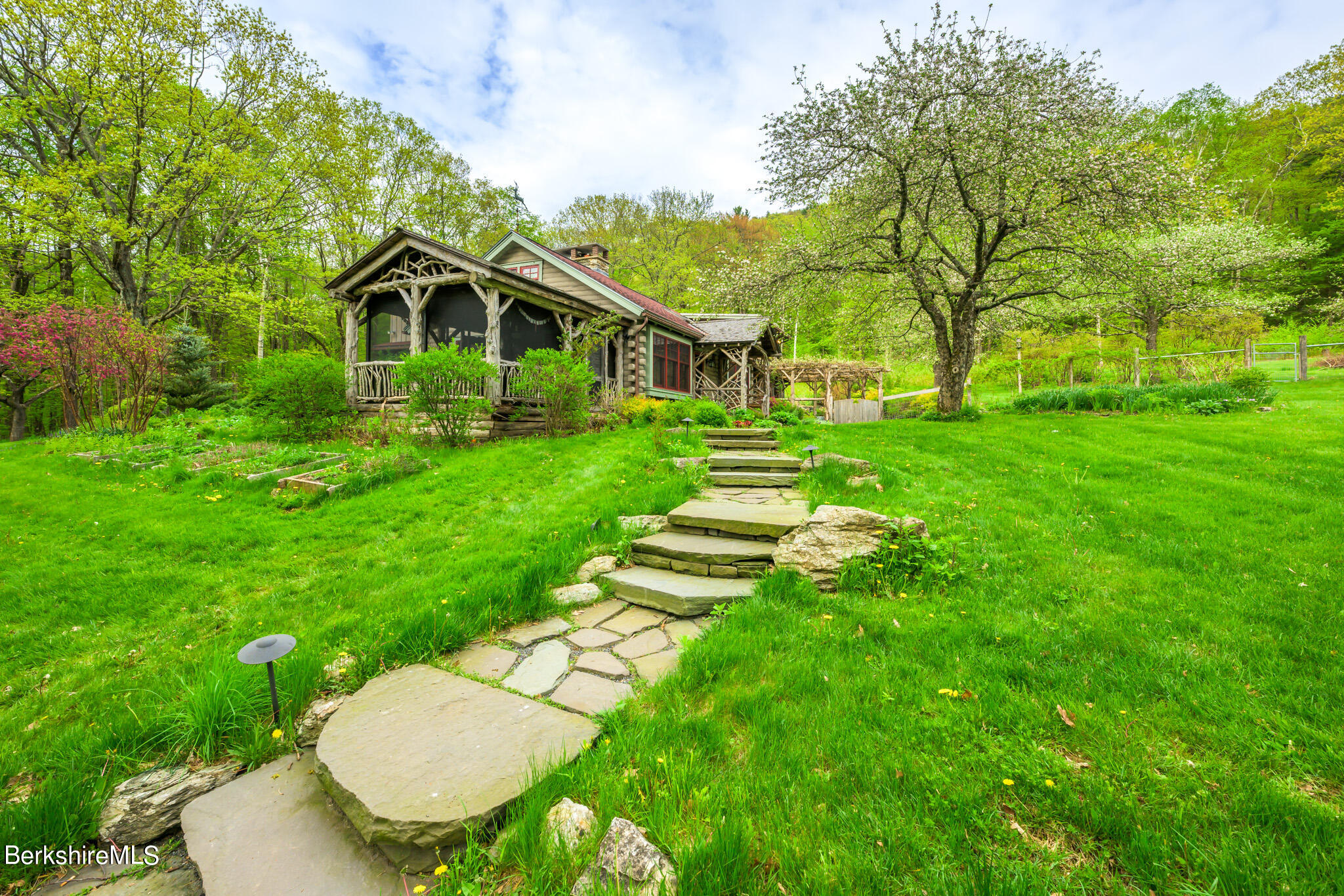 258 E Road Alford, MA 01266 - Photo 4 of 38 a view of a house with a yard table and chairs