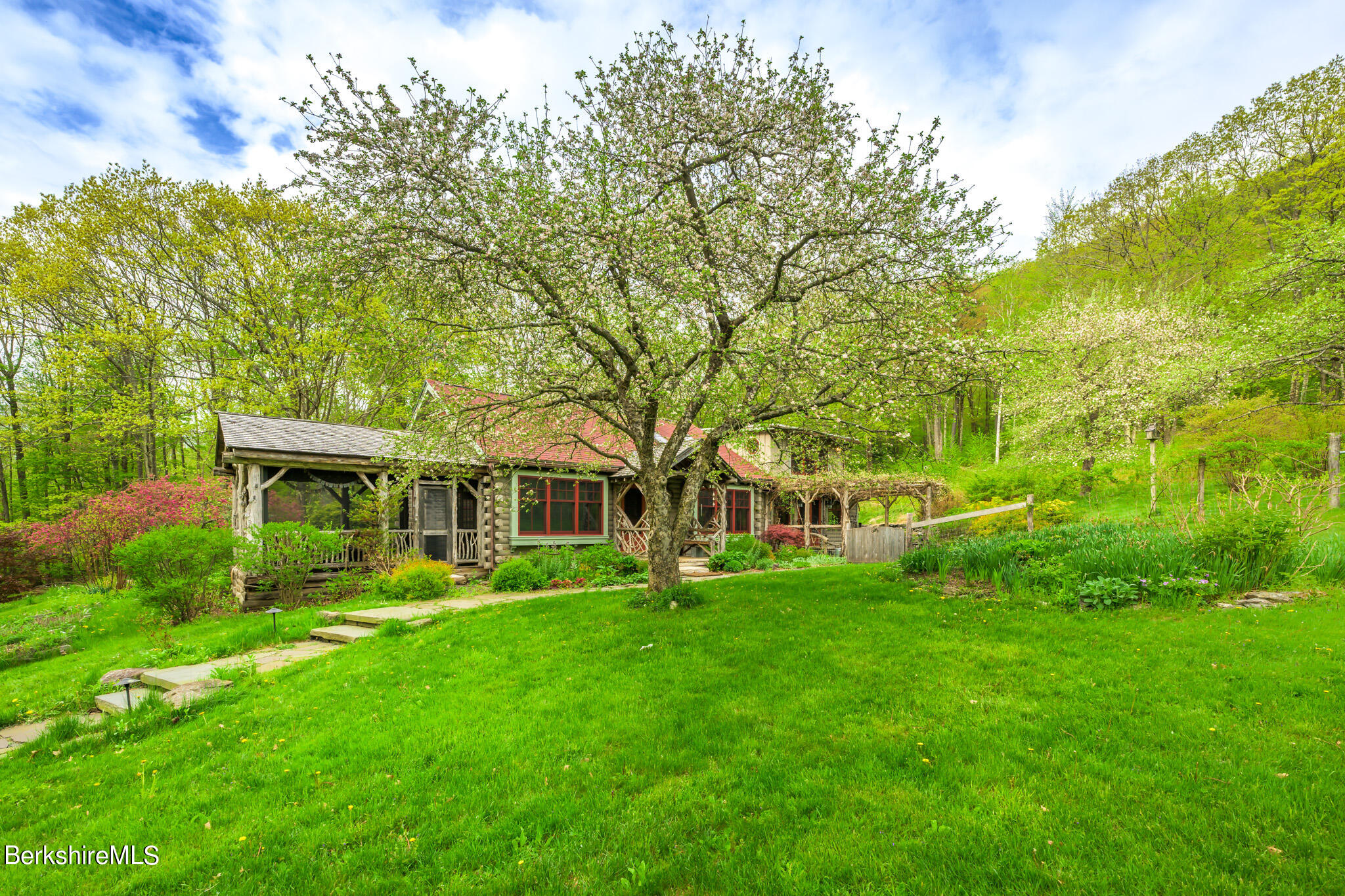 258 E Road Alford, MA 01266 - Photo 6 of 38 a front view of a house with garden and trees