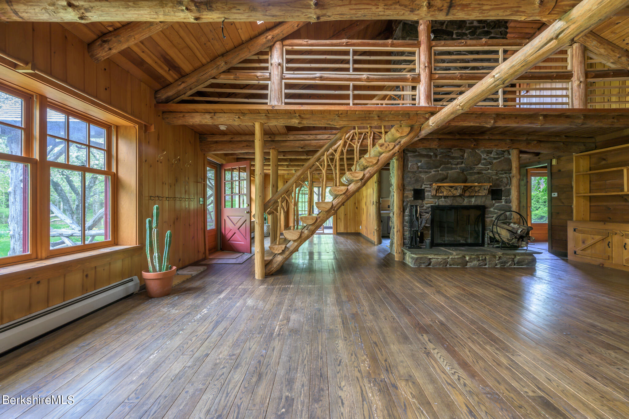 258 E Road Alford, MA 01266 - Photo 10 of 38 a view of an entryway with wooden floor fire place