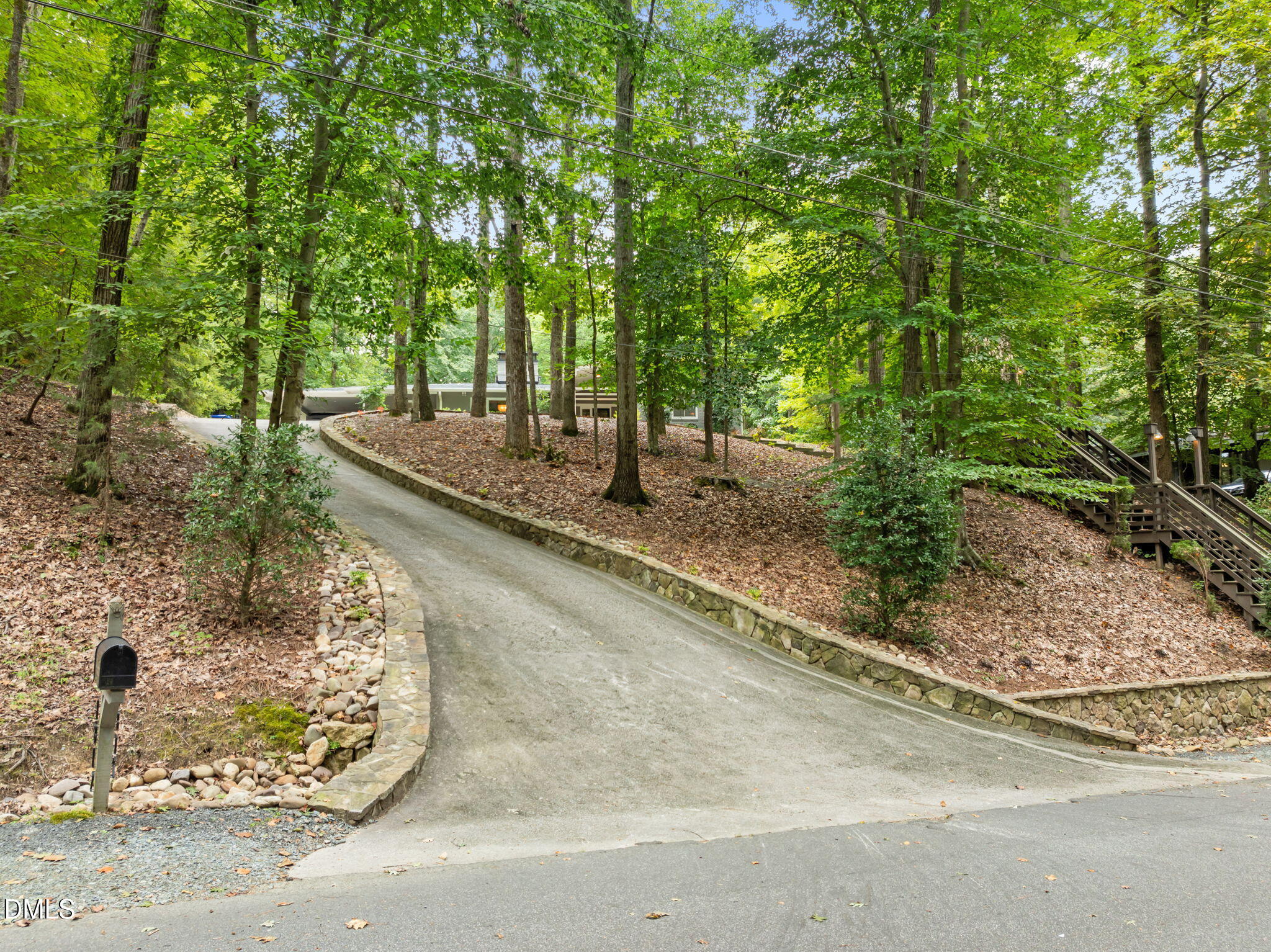 1812 Rolling Road Chapel Hill, NC 27514 - Photo 57 of 72 a view of a backyard with large trees