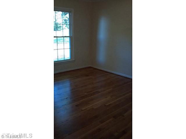 5606 Bunch Road Oak Ridge, NC 27310 - Photo 12 of 16 2nd Bedroom. 2nd bedroom has plenty of light and gorgeous hardwoods that are freshly refinished