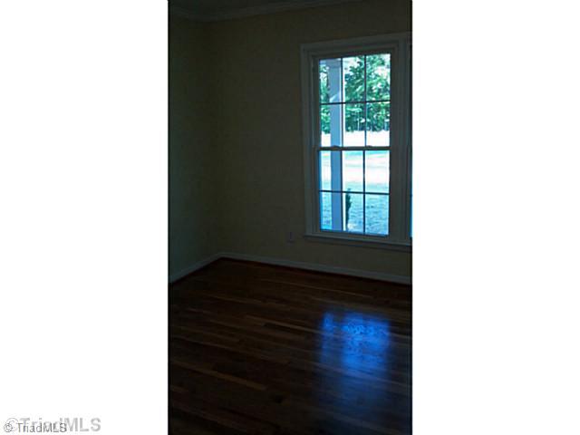 5606 Bunch Road Oak Ridge, NC 27310 - Photo 13 of 16 3rd Bedroom. 3rd bedroom is also light-filled and has gleaming hardwoods