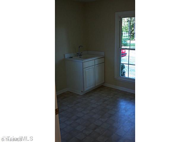 5606 Bunch Road Oak Ridge, NC 27310 - Photo 16 of 16 Laundry Room. Oversized mud/laundry room is plenty big for ironing, storage, and dropping the kids stuff off