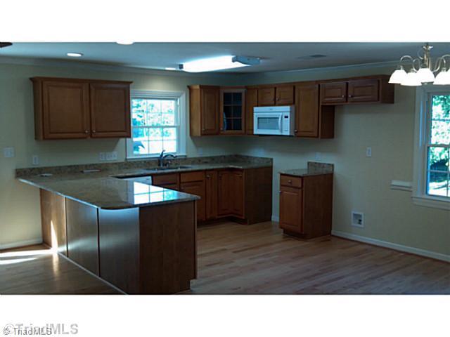 5606 Bunch Road Oak Ridge, NC 27310 - Photo 7 of 16 Kitchen. Like most everything else, the kitchen is brand new. Granite counters, cabinets, appliances, sink etc are all new.