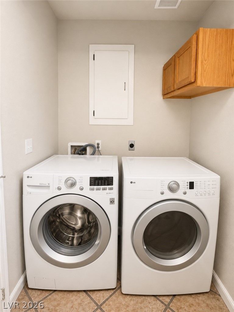 7213 London Bridge Avenue Las Vegas, NV 89130 - Photo 6 of 11 This dedicated space offers convenience with a washer and dryer, simplifying daily chores.
