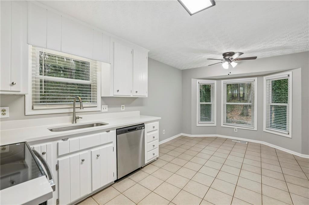 1076 Blackwell Road Marietta, GA 30066 - Photo 11 of 34 a view of a kitchen with sink cabinets and outdoor space