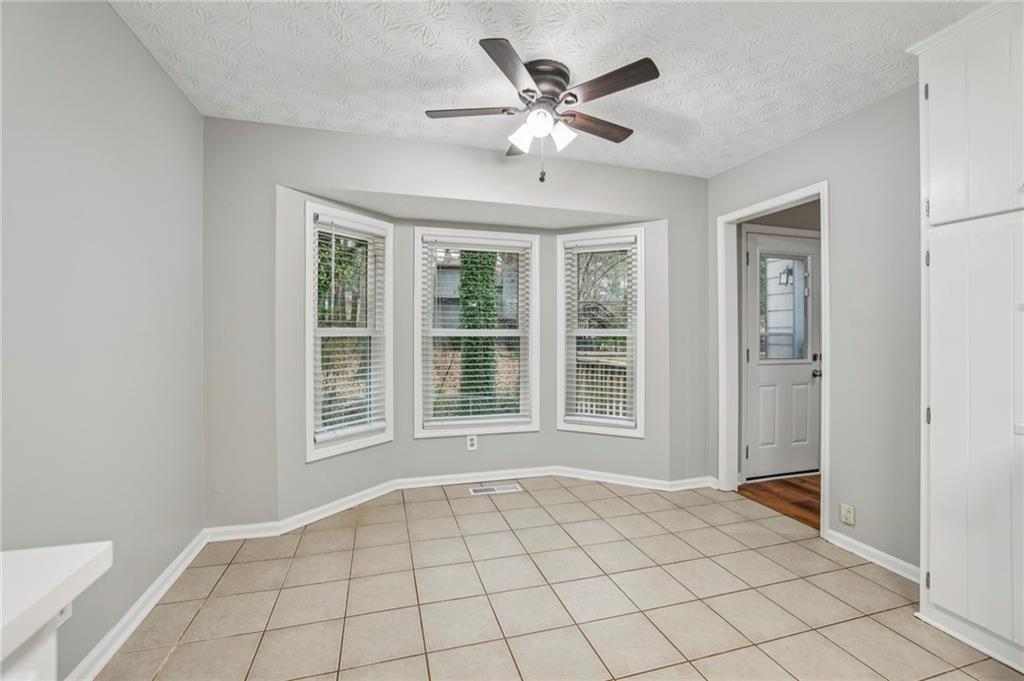 1076 Blackwell Road Marietta, GA 30066 - Photo 14 of 34 a view of an empty room with a window