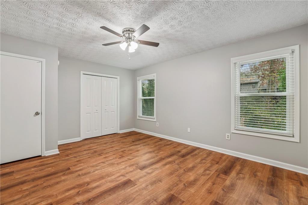 1076 Blackwell Road Marietta, GA 30066 - Photo 17 of 34 a view of an empty room with wooden floor and a window