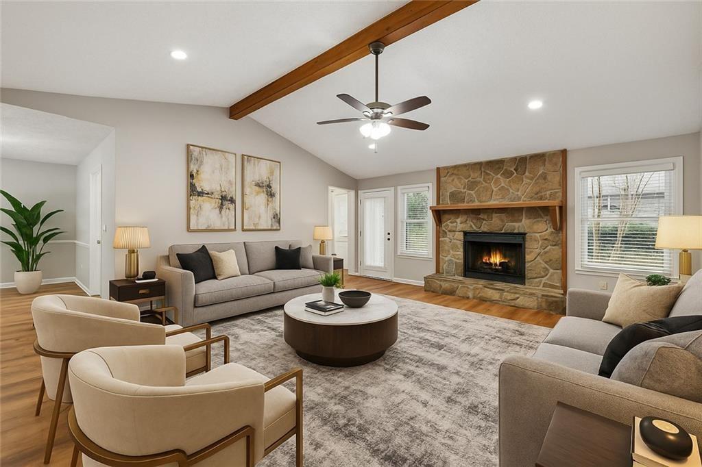 1076 Blackwell Road Marietta, GA 30066 - Photo 4 of 34 a living room with furniture and a fireplace